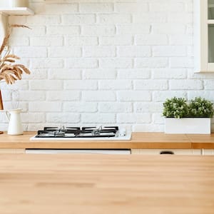 Modern minimal kitchen with wood countertops