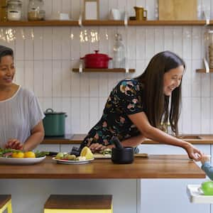 Family preparing food in kitchen