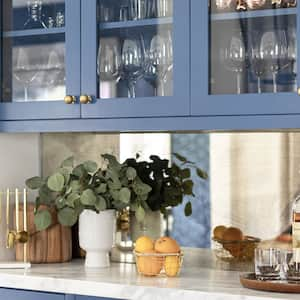 Luxurious blue cabinets with glass in kitchen