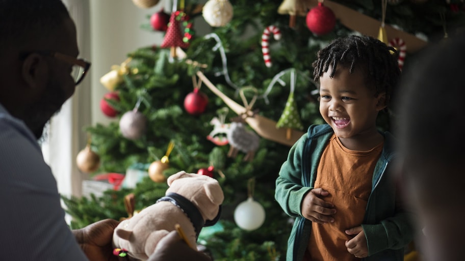 A happy kid receiving a christmas present