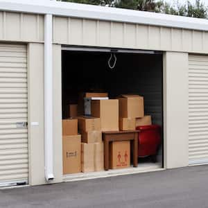 A self-storage unit filled with cardboard boxes