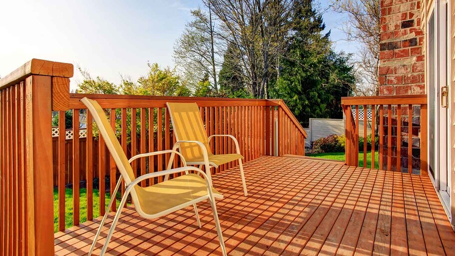 Cozy patio deck with yellow outdoor chairs