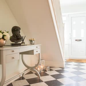 An entryway with ceramic tiles for flooring