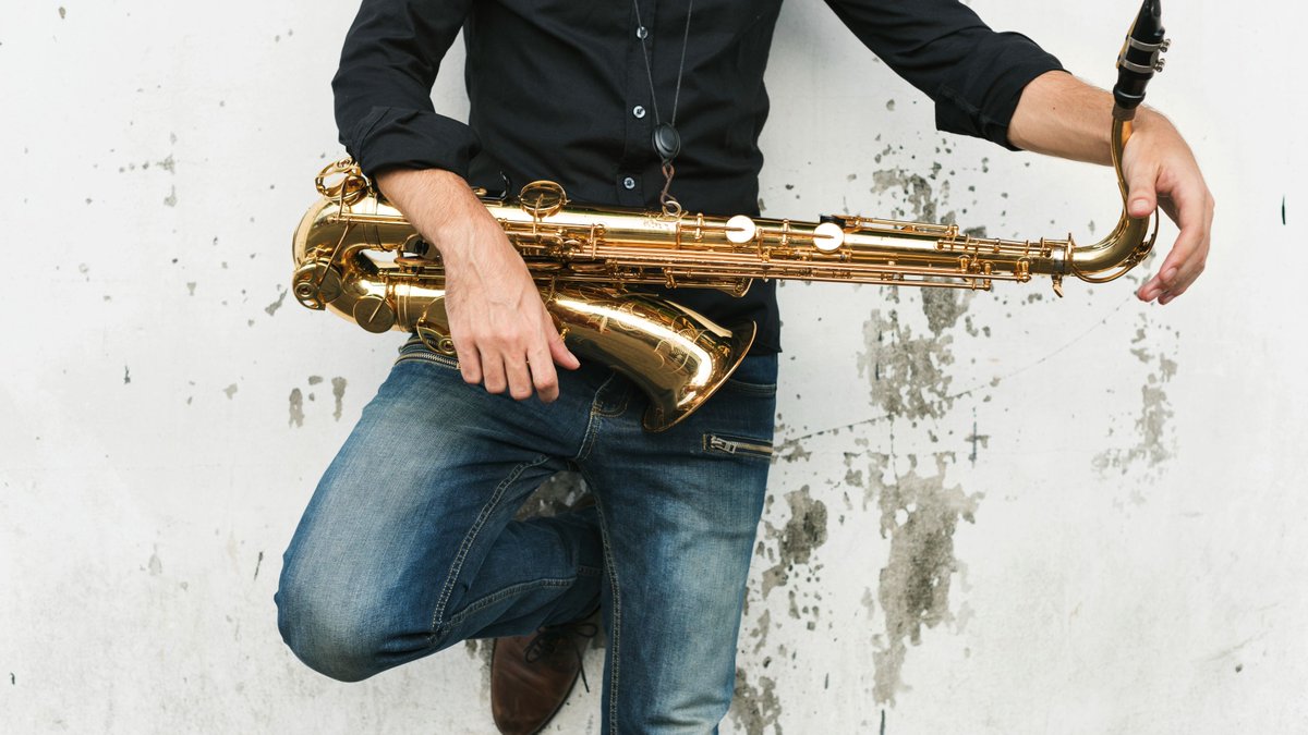 Male musician with alto saxophone