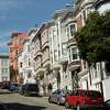 Homes along Montgomery Street near the parking structure at 955 Sansome Street that is the proposed location for a 10-story building in the Telegraph Hill neighborhood of San Francisco, Calif., on Tuesday, March 29, 2022.