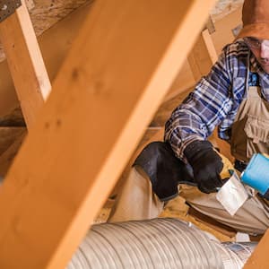 A contractor binding ventilation pipes