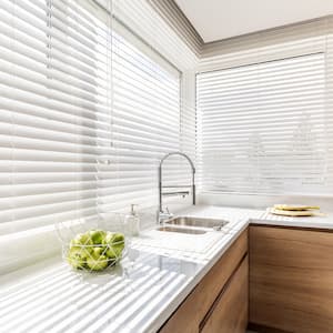 A bright kitchen with blinds