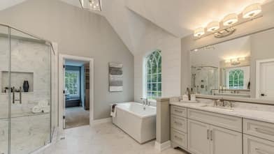 A master bathroom with track lighting