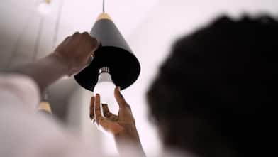 A woman adding new LED bulb