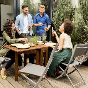 Group of friends having a reunion on the patio