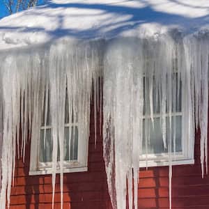 Ice dams and snow on the roof of a house
