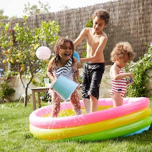 Children play in a wading pool