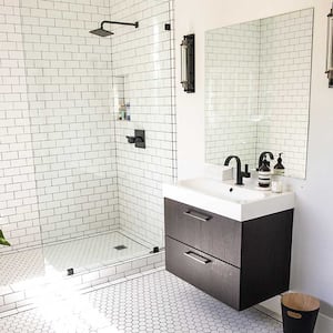 A bathroom with a walk-in shower