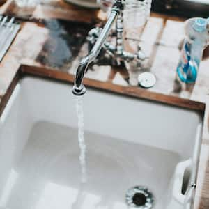 A kitchen sink with running water