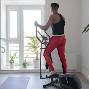 A man using elliptical trainer