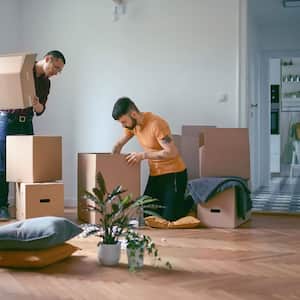 Couple unpacking boxes in a new home
