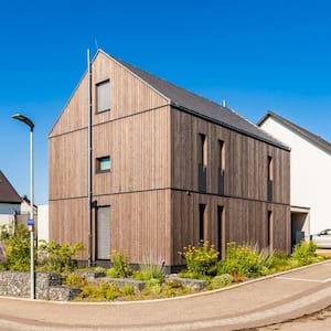  The exterior of a modern house made of sustainable wood