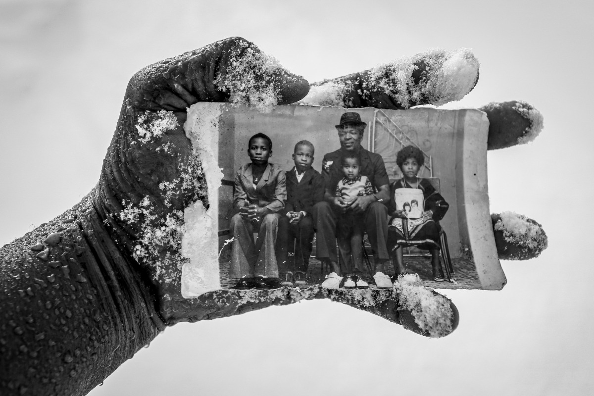 Photograph of a black person's hand holding a black and white photograph. Credit: © Cletus Nelson Nwadike, Sony World Photography Awards 2022