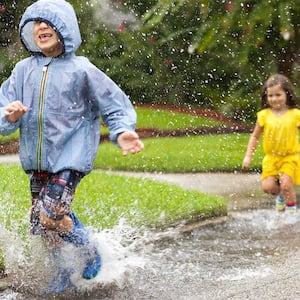 Children splash in the rain