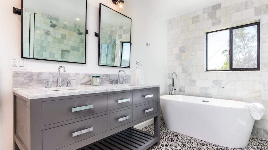 Tiled floors and wall in bathroom