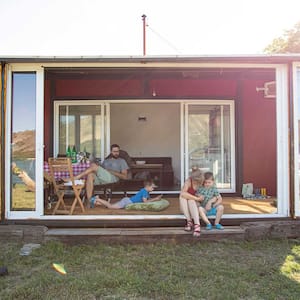 Family outside tiny house