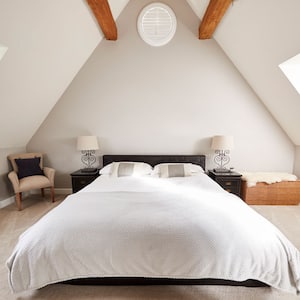 A bright attic used as a bedroom