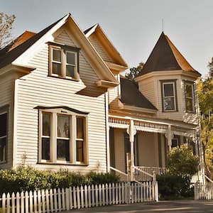 A historic home with picket fence