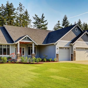 blue suburban home with yard space