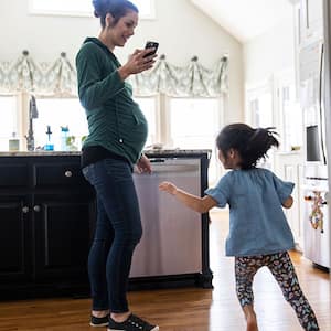 Woman and daughter in kitchen