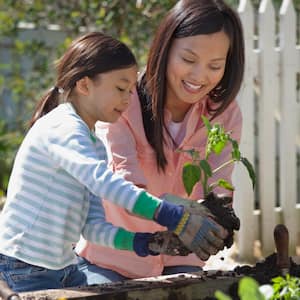 Mother and daughter gardening together