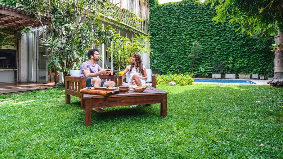 Couple having breakfast in the yard