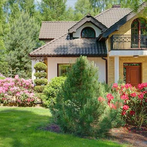 Two story house with well-maintained backyard