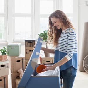 A woman in new apartment unpacking