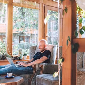 Man sits in sunroom