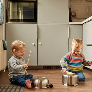 Children playing in kitchen