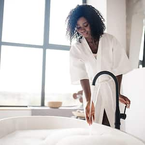 Woman running water in a bath