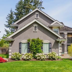 luxury grey house with landscaping