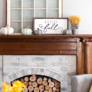 A fireplace with fall decoration 