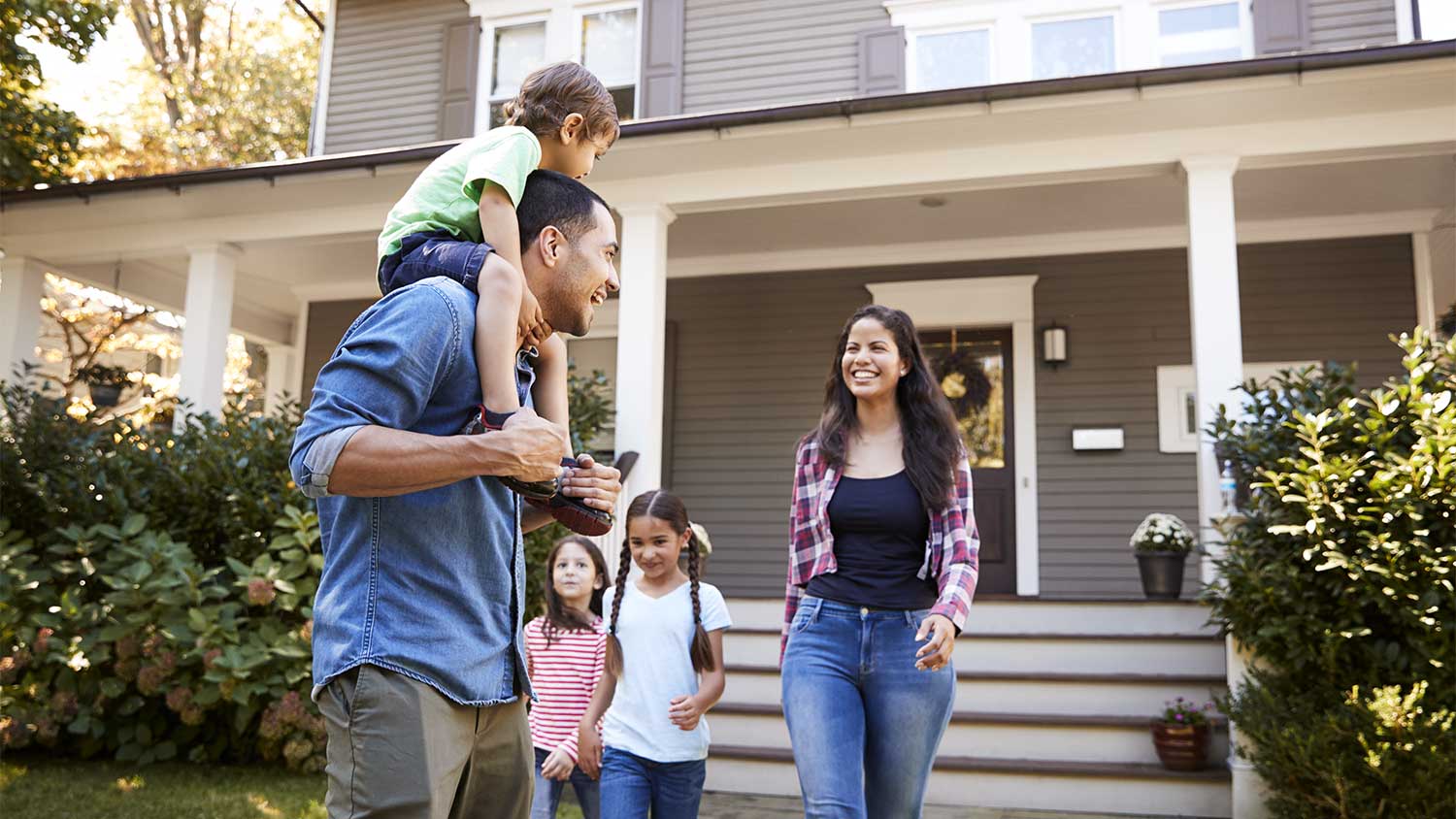 A family outside their home