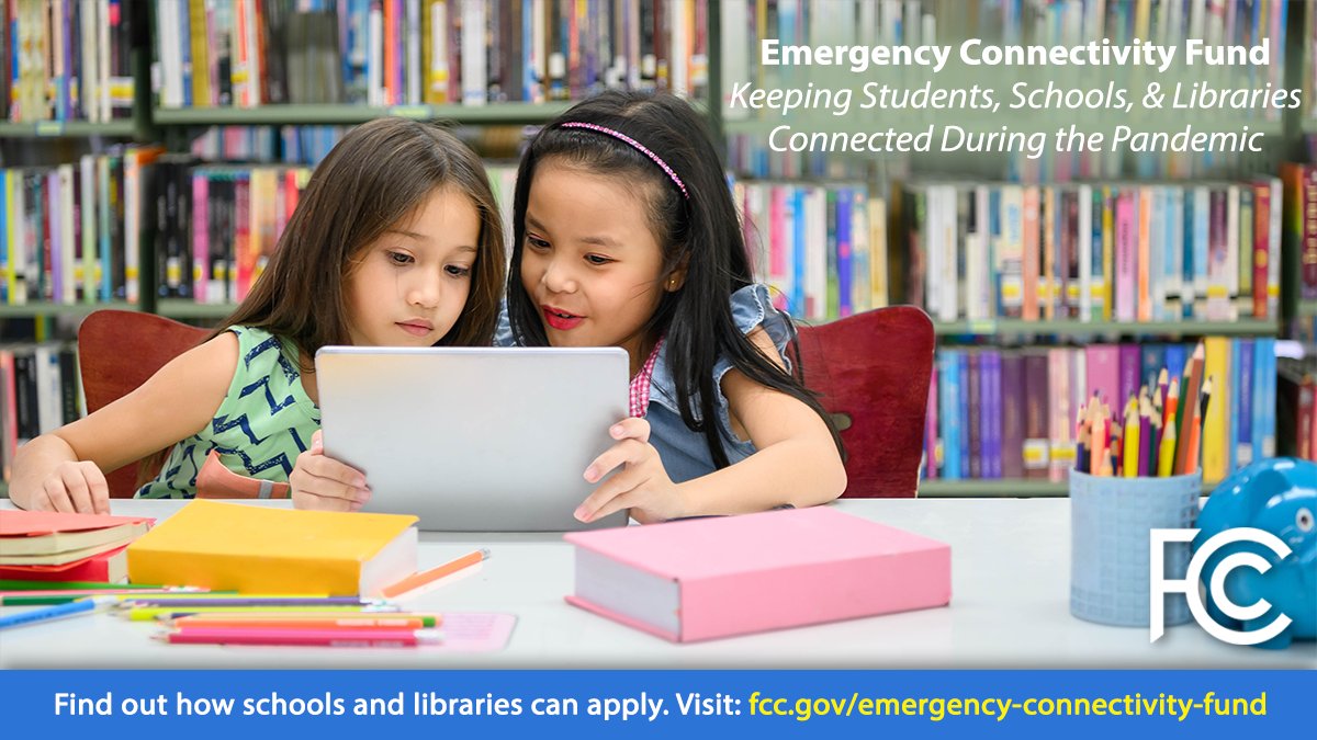 Emergency Connectivity Fund. Girls using tablet at a in a library.