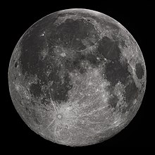 Full Moon in the darkness of the night sky. It is patterned with a mix of light-tone regions and darker, irregular blotches, and scattered with varied circles surrounded by out-thrown rays of bright ejecta: impact craters.