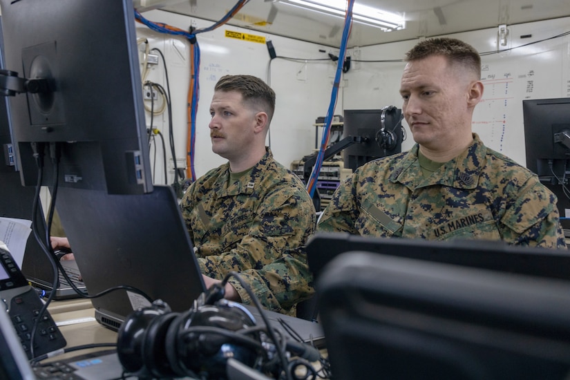 Marines monitor data.