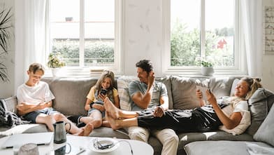 happy family sitting on the sofa in the living room