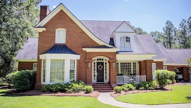 Exterior of a traditional colonial red brick house