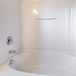 A bathtub with acrylic surround