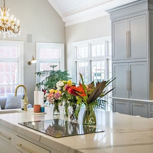 elegant kitchen with flowers and gold accents