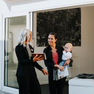 A estate agent showing a house to a woman 