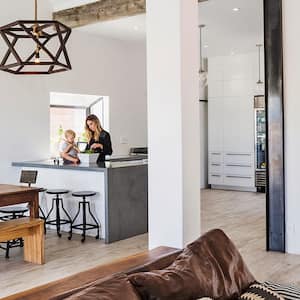 woman at home with children in the kitchen dining area