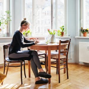 A woman sitting in the living room 