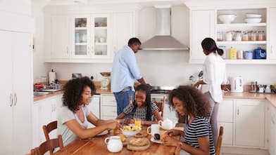 family of 5 spending time in the kitchen 